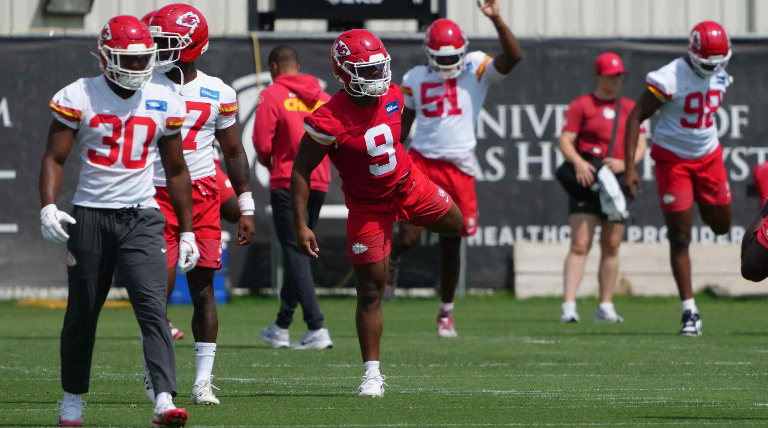 Kansas City Chiefs players warming up.